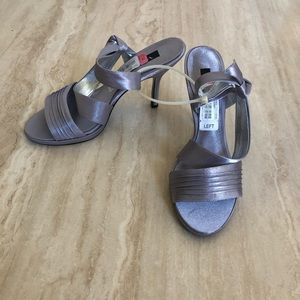 Women’s high heeled silver sandals. Size 10